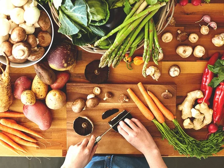 A chopping board covered in fresh seasonal vegetables